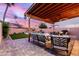 Inviting covered patio, dining set, and cozy seating create the perfect relaxation spot at 4106 E Muirwood Dr, Phoenix, AZ 85048