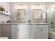 Stylish bathroom with double vanity, granite countertops, and modern fixtures at 4106 E Muirwood Dr, Phoenix, AZ 85048