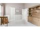 Bedroom with a crib, built-in shelving, and soft carpeting at 4106 E Muirwood Dr, Phoenix, AZ 85048