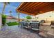 Inviting covered patio with stylish seating, a ceiling fan, and a view of the pool and backyard at 4106 E Muirwood Dr, Phoenix, AZ 85048