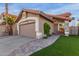 Charming home with lush green lawn, rock details, and a paved walkway at 4106 E Muirwood Dr, Phoenix, AZ 85048