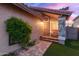 Inviting front porch with stone pillars, a bench, and a decorative front door at 4106 E Muirwood Dr, Phoenix, AZ 85048