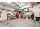 Spacious garage with ample storage and workspace, perfect for a workshop or parking vehicles at 4106 E Muirwood Dr, Phoenix, AZ 85048
