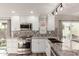 Bright kitchen featuring granite counters, stainless steel appliances, and stylish backsplash at 4106 E Muirwood Dr, Phoenix, AZ 85048