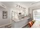 Open kitchen showcases granite countertops, modern lighting, and sleek white cabinetry at 4106 E Muirwood Dr, Phoenix, AZ 85048
