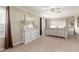 Comfortable main bedroom featuring a large bed, dresser, and elegant decor at 4106 E Muirwood Dr, Phoenix, AZ 85048