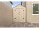 A matching storage shed tucked between the home and fence on top of a brick platform at 4106 E Muirwood Dr, Phoenix, AZ 85048