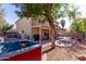 Expansive backyard showcasing a covered patio and a hot tub, perfect for outdoor entertaining and relaxation at 424 W Midland Ln, Gilbert, AZ 85233