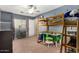 bedroom with a creative layout, ladder to a bunk bed and study space at 424 W Midland Ln, Gilbert, AZ 85233