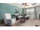 Bright living area boasts a ceiling fan and a cozy recliner for ultimate relaxation at 424 W Midland Ln, Gilbert, AZ 85233