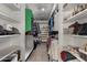 Organized walk-in closet with shelves for shoes, hats, and folded clothing, providing ample storage space at 424 W Midland Ln, Gilbert, AZ 85233
