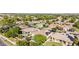 Nice aerial view of community featuring lush landscaping, pools, and beautiful homes in the desert at 5226 S Fairchild Ln, Chandler, AZ 85249