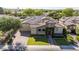 Aerial view of a well-maintained home featuring solar panels, manicured lawns, and a spacious driveway at 5226 S Fairchild Ln, Chandler, AZ 85249