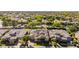 Extensive aerial view of property featuring solar panels and a tile roof nestled in a green, lush neighborhood at 5226 S Fairchild Ln, Chandler, AZ 85249