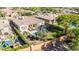 A beautiful backyard showcases a sparkling pool, manicured lawn, patio seating, and vibrant flowers at 5226 S Fairchild Ln, Chandler, AZ 85249