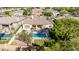 An inviting backyard features a pool, spa, patio seating, a grassy area, and lush landscaping at 5226 S Fairchild Ln, Chandler, AZ 85249