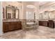 Luxurious bathroom features dual vanities, a soaking tub, and beautiful tile work at 5226 S Fairchild Ln, Chandler, AZ 85249