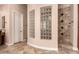 Bathroom featuring tiled shower with glass blocks, a vanity, and a doorway at 5226 S Fairchild Ln, Chandler, AZ 85249