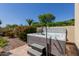 Private hot tub with surrounding greenery and hardscape to relax and enjoy outdoor living at 5226 S Fairchild Ln, Chandler, AZ 85249