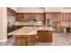 Well-equipped kitchen features an island, stainless appliances, and generous cabinet space at 5226 S Fairchild Ln, Chandler, AZ 85249