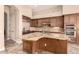 Spacious kitchen with a large island, granite countertops, and stainless steel appliances at 5226 S Fairchild Ln, Chandler, AZ 85249