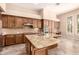 Elegant kitchen boasts granite counters, an island, and modern stainless steel appliances at 5226 S Fairchild Ln, Chandler, AZ 85249
