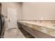 Spacious laundry room featuring a folding counter and updated appliances at 5226 S Fairchild Ln, Chandler, AZ 85249