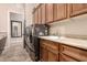 Laundry room with a sink, cabinets, and a washer/dryer unit at 5226 S Fairchild Ln, Chandler, AZ 85249