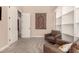 Comfortable living room with built-in shelves and cozy armchairs at 5226 S Fairchild Ln, Chandler, AZ 85249