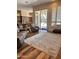 Bright living room with sliding glass doors, hardwood floors, and an adjacent kitchen at 5226 S Fairchild Ln, Chandler, AZ 85249