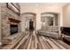 Cozy living room with stone fireplace, hardwood floors, and comfortable seating at 5226 S Fairchild Ln, Chandler, AZ 85249