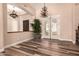 Bright living room with hardwood floors, stylish light fixtures, and views to the backyard at 5226 S Fairchild Ln, Chandler, AZ 85249