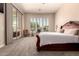 Serene main bedroom with sliding door, plantation shutters, and plush carpeting at 5226 S Fairchild Ln, Chandler, AZ 85249