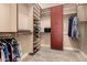 Spacious walk-in closet with custom shelving and storage solutions at 5226 S Fairchild Ln, Chandler, AZ 85249
