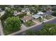 A residential street is displayed in this aerial view; many homes have mature trees on the property at 549 N Olive --, Mesa, AZ 85203