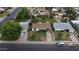An aerial view shows the home with a well-maintained front yard and driveway in a residential neighborhood at 549 N Olive --, Mesa, AZ 85203