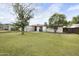 Expansive backyard featuring lush lawn, mature trees, and a storage shed, perfect for outdoor living at 549 N Olive --, Mesa, AZ 85203