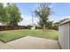 Spacious grassy backyard featuring a small storage shed and ample space for outdoor activities at 549 N Olive --, Mesa, AZ 85203