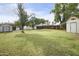 Wide backyard with fenced yard and shed storage at 549 N Olive --, Mesa, AZ 85203