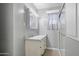 Clean bathroom featuring a vanity with new light fixture and tiled walk-in shower at 549 N Olive --, Mesa, AZ 85203