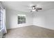 Neutral bedroom featuring a ceiling fan, tile floors, and a bright window at 549 N Olive --, Mesa, AZ 85203