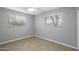 Neutral bedroom with two windows, tile floors, and a ceiling fan at 549 N Olive --, Mesa, AZ 85203