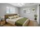 Stylish bedroom featuring a wood bedframe, neutral tones, and ample natural light at 549 N Olive --, Mesa, AZ 85203