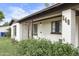 Charming home's exterior with a well-maintained lawn and blooming flower bushes at 549 N Olive --, Mesa, AZ 85203