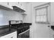 Upgraded stainless steel gas range with countertop and light gray tile backsplash at 549 N Olive --, Mesa, AZ 85203