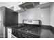 Upgraded stainless steel gas cooktop with light gray tile backsplash and countertop at 549 N Olive --, Mesa, AZ 85203