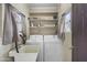 Laundry room with washer, dryer, sink, and shelves at 549 N Olive --, Mesa, AZ 85203