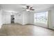 Inviting living room featuring large window, tile floors, and ceiling fan at 549 N Olive --, Mesa, AZ 85203