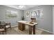 Cozy office area featuring a rustic wooden desk, natural light, and room for productivity at 549 N Olive --, Mesa, AZ 85203