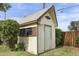 Exterior view of a small storage shed with trees around at 549 N Olive --, Mesa, AZ 85203